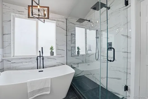 a bathroom with a double vanity sink mirror and