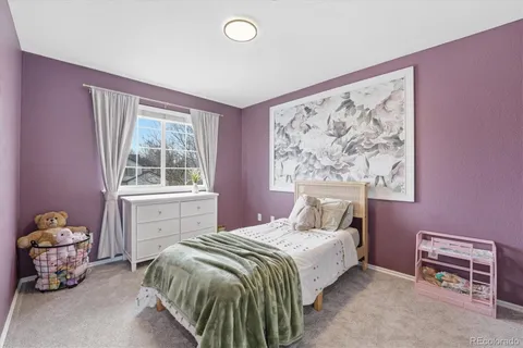 a bedroom with a bed and walk in closet