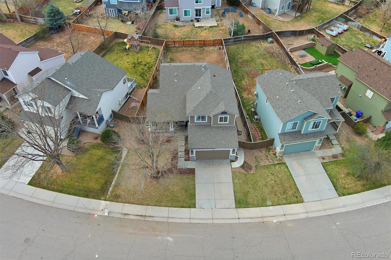 9387 Wolfe Drive Highlands Ranch, CO 80129 - Photo 48 of 50 an aerial view of residential houses with outdoor space