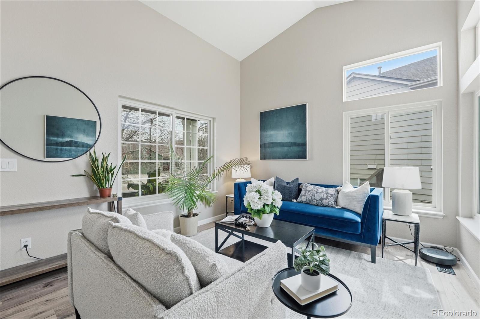 9387 Wolfe Drive Highlands Ranch, CO 80129 - Photo 7 of 50 a living room with furniture a window and a potted plant