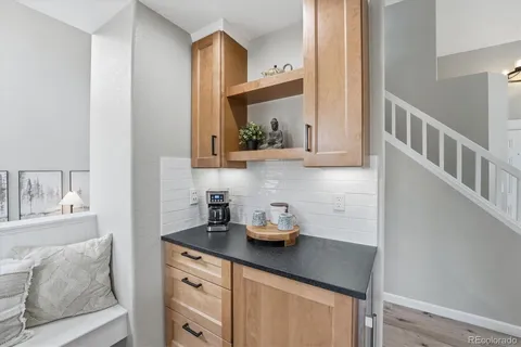 a kitchen with stainless steel appliances a sink a stove and cabinets