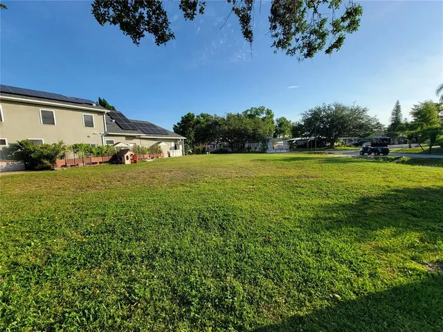 a view of a house with a big yard
