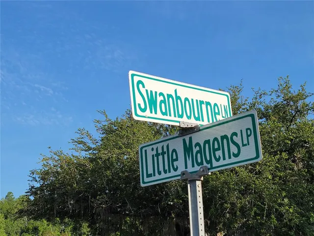a street sign sitting on the side of a road