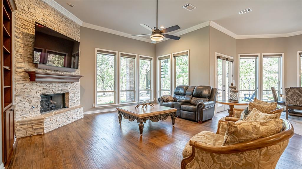 400 Porter Road Bartonville, TX 76226 - Photo 13 of 40 a living room with fireplace furniture and a large window
