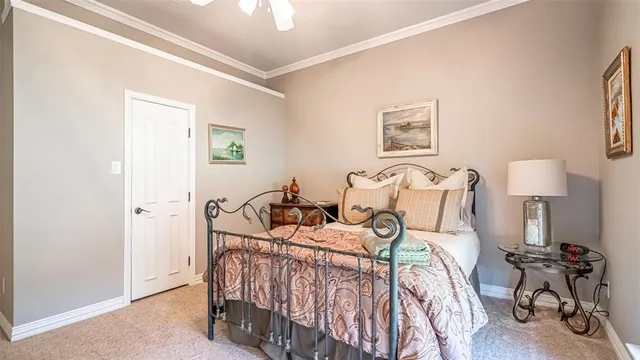 a bed room with two bed and a chair