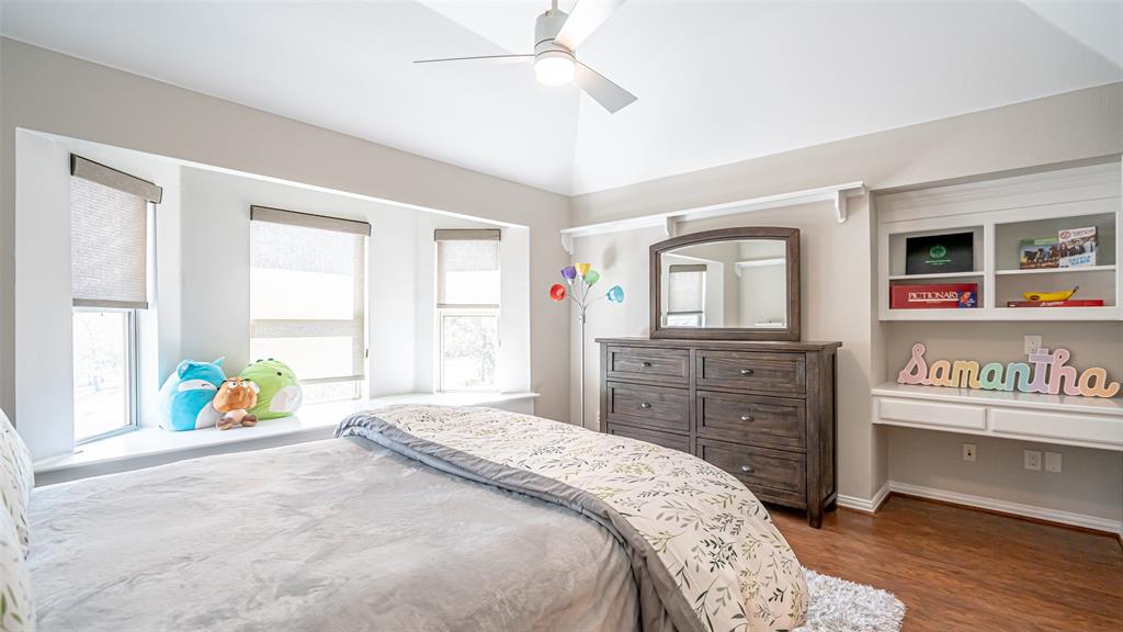 400 Porter Road Bartonville, TX 76226 - Photo 19 of 40 a bedroom with a bed and wooden floor