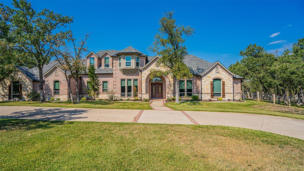 400 Porter Road Bartonville, TX 76226 - Photo 2 of 40 a front view of a house with swimming pool and porch