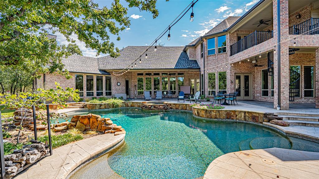400 Porter Road Bartonville, TX 76226 - Photo 26 of 40 a view of a house with swimming pool and porch with furniture