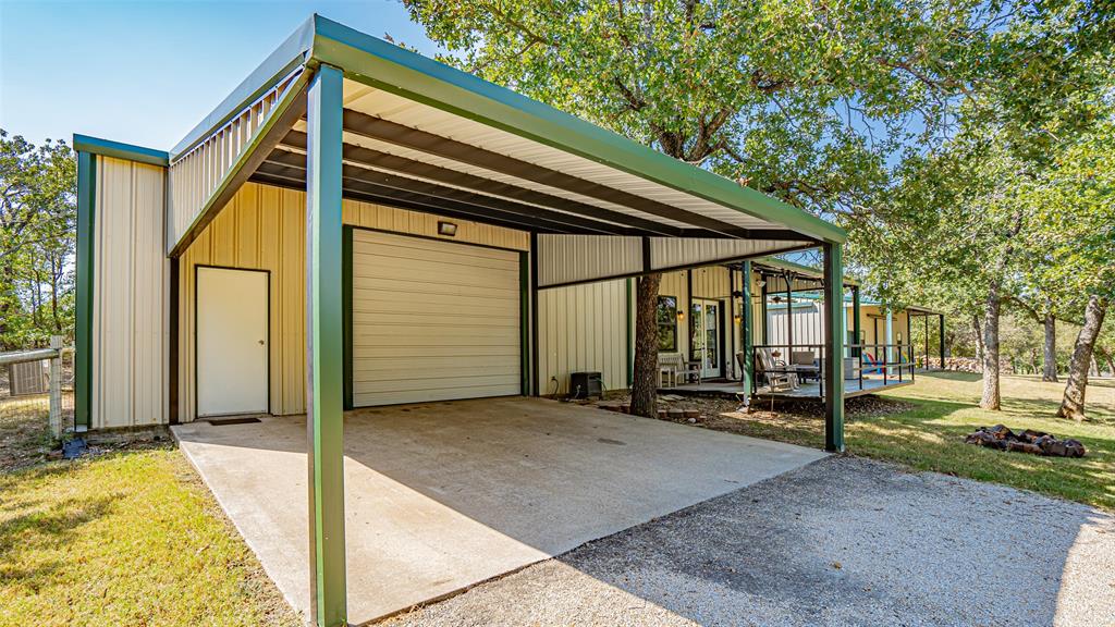 400 Porter Road Bartonville, TX 76226 - Photo 30 of 40 a backyard of a house with barbeque oven table and chairs