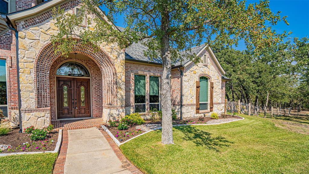 400 Porter Road Bartonville, TX 76226 - Photo 3 of 40 a front view of a house with garden