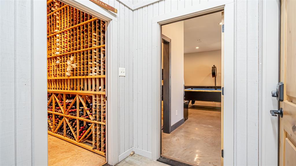 400 Porter Road Bartonville, TX 76226 - Photo 31 of 40 a view of a hallway with wooden floor and a bathroom