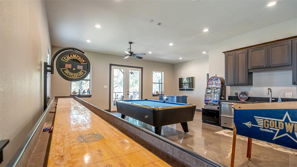 400 Porter Road Bartonville, TX 76226 - Photo 32 of 40 a very nice looking open dining room with kitchen island granite countertop a large window and a couch