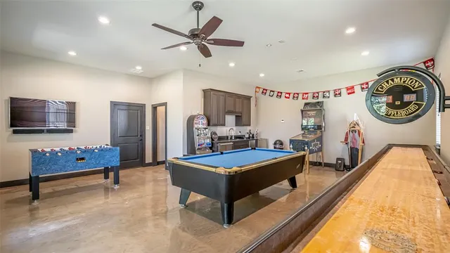 a living room with furniture and flat screen tv