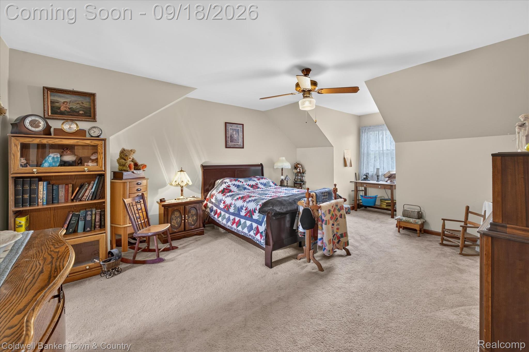 4442 McGunn Road Howell, MI 48843 - Photo 26 of 63 Carpeted bedroom with sloped ceilings, ceiling fan, and window with natural light