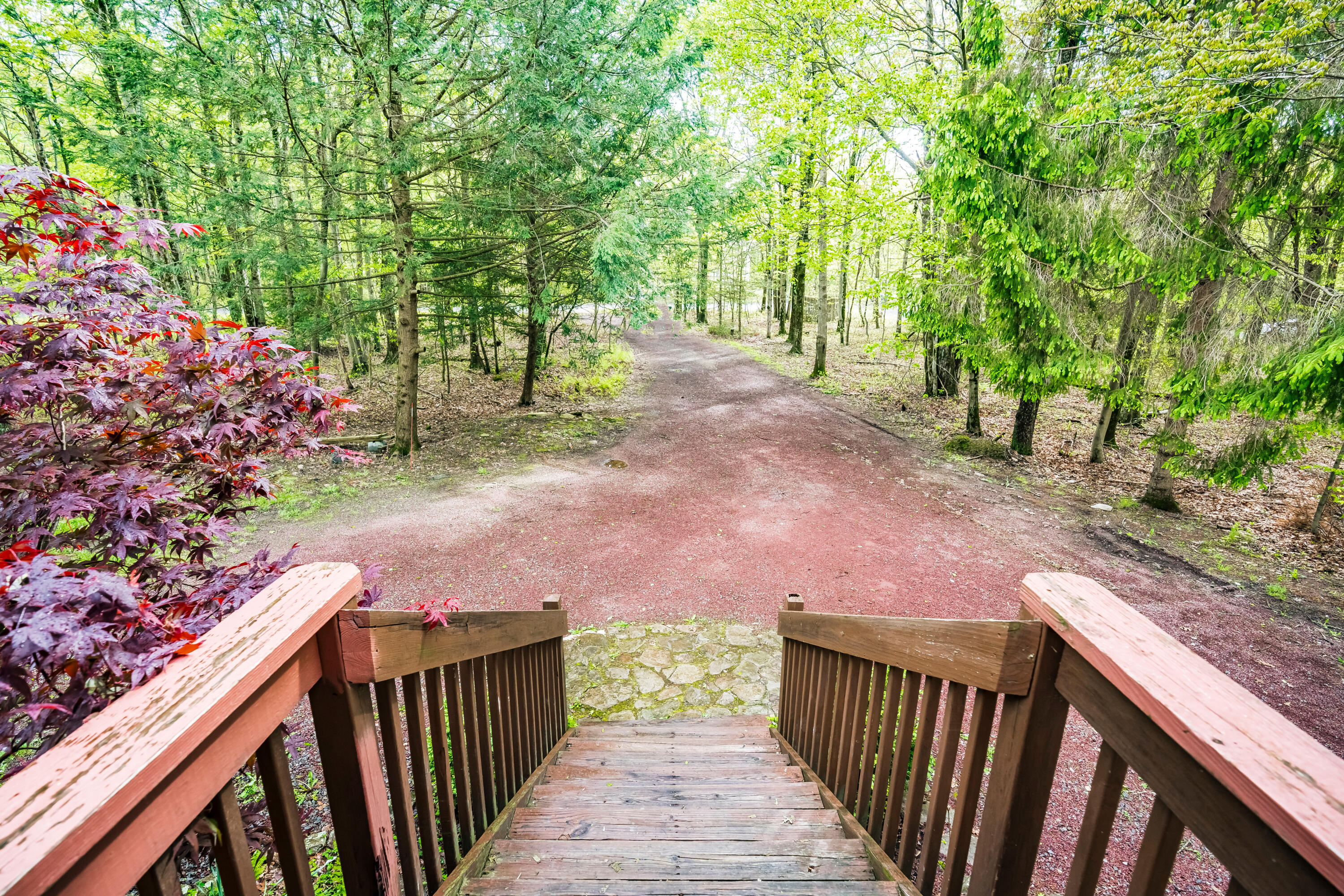 205 Victory Lane Long Pond, PA 18334 - Photo 11 of 51 a view of a pathway with a wooden fence