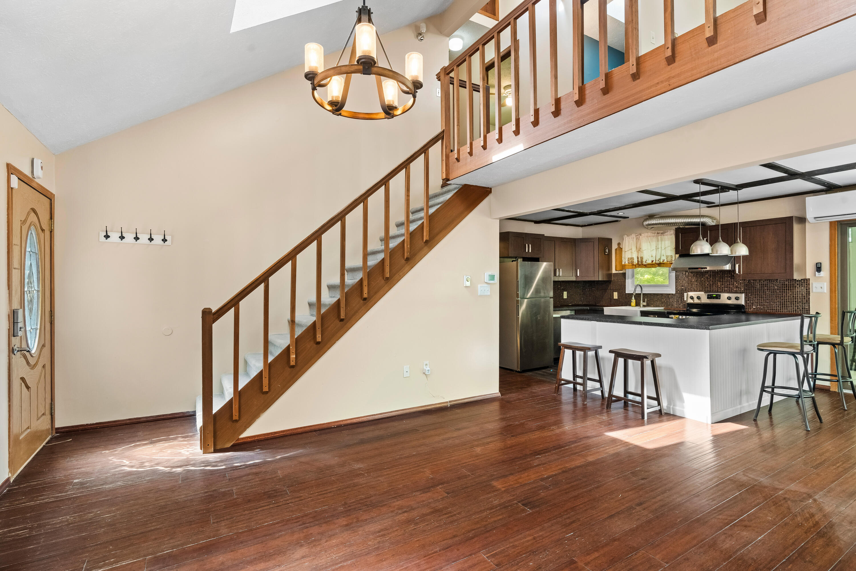 205 Victory Lane Long Pond, PA 18334 - Photo 13 of 51 a view of entryway and kitchen with wooden floor