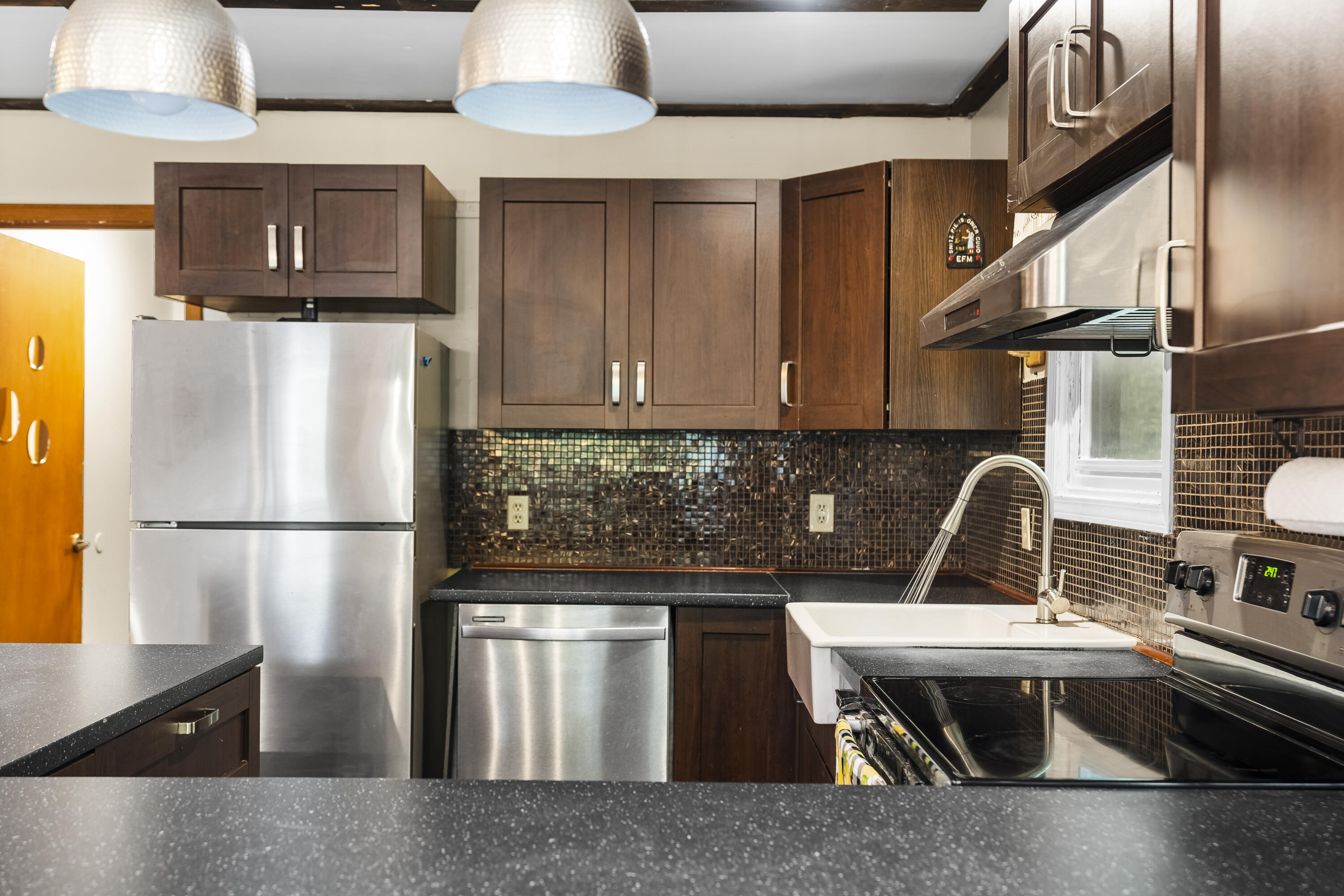 205 Victory Lane Long Pond, PA 18334 - Photo 18 of 51 a kitchen with stainless steel appliances granite countertop a refrigerator a stove a sink and white cabinets