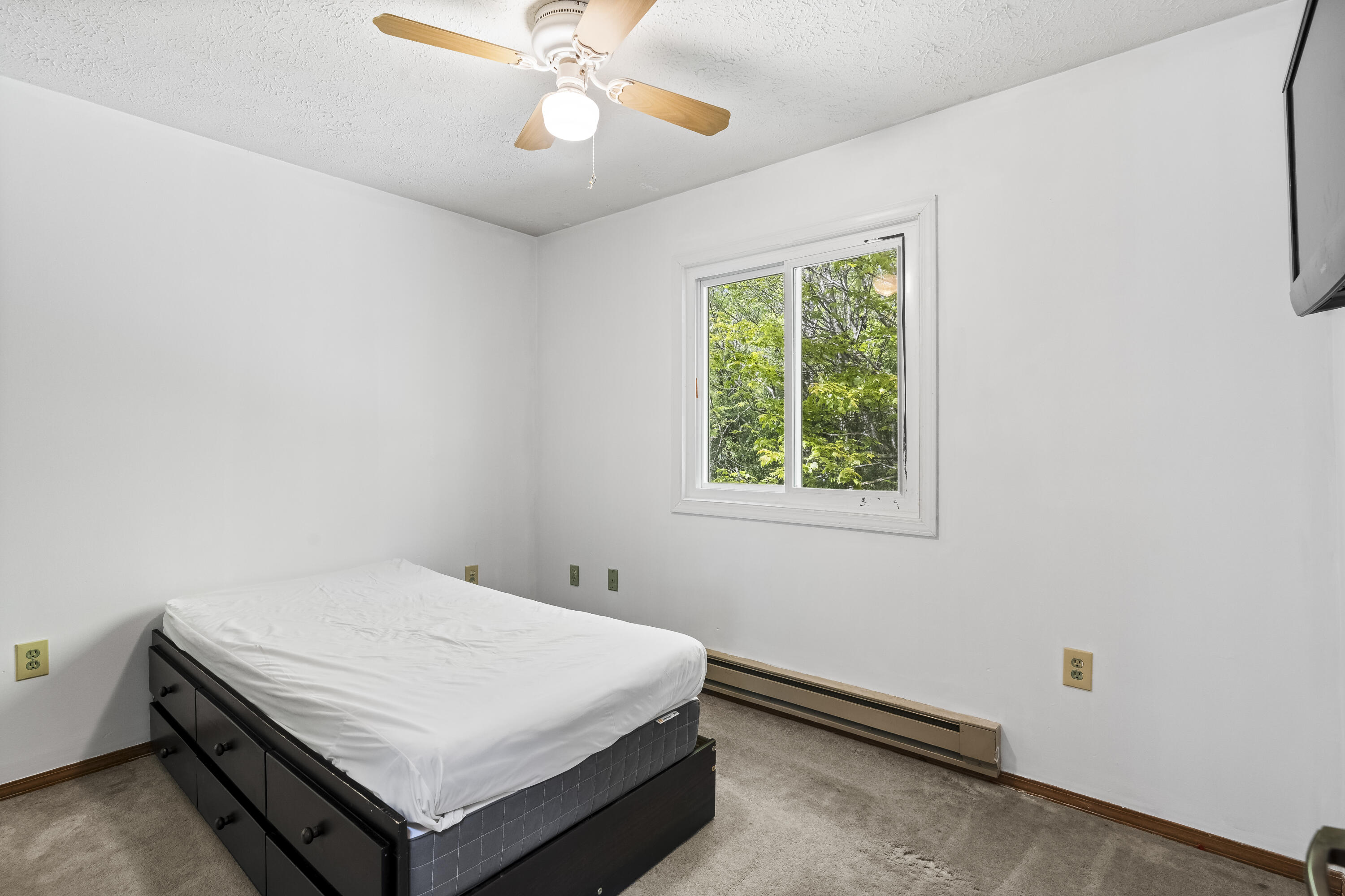 205 Victory Lane Long Pond, PA 18334 - Photo 33 of 51 a bedroom with a bed and a chandelier