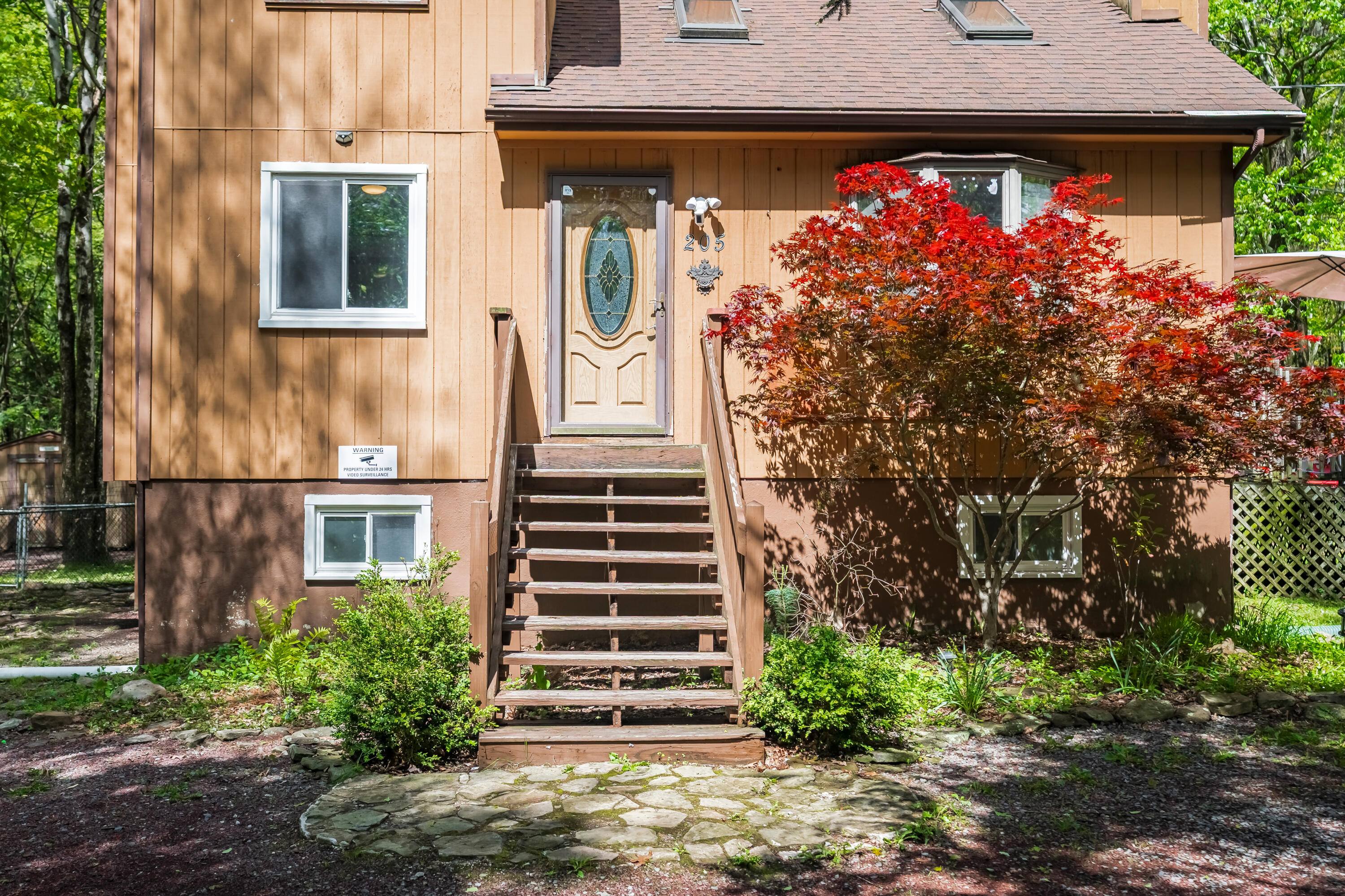 205 Victory Lane Long Pond, PA 18334 - Photo 7 of 51 a front view of a house with plants