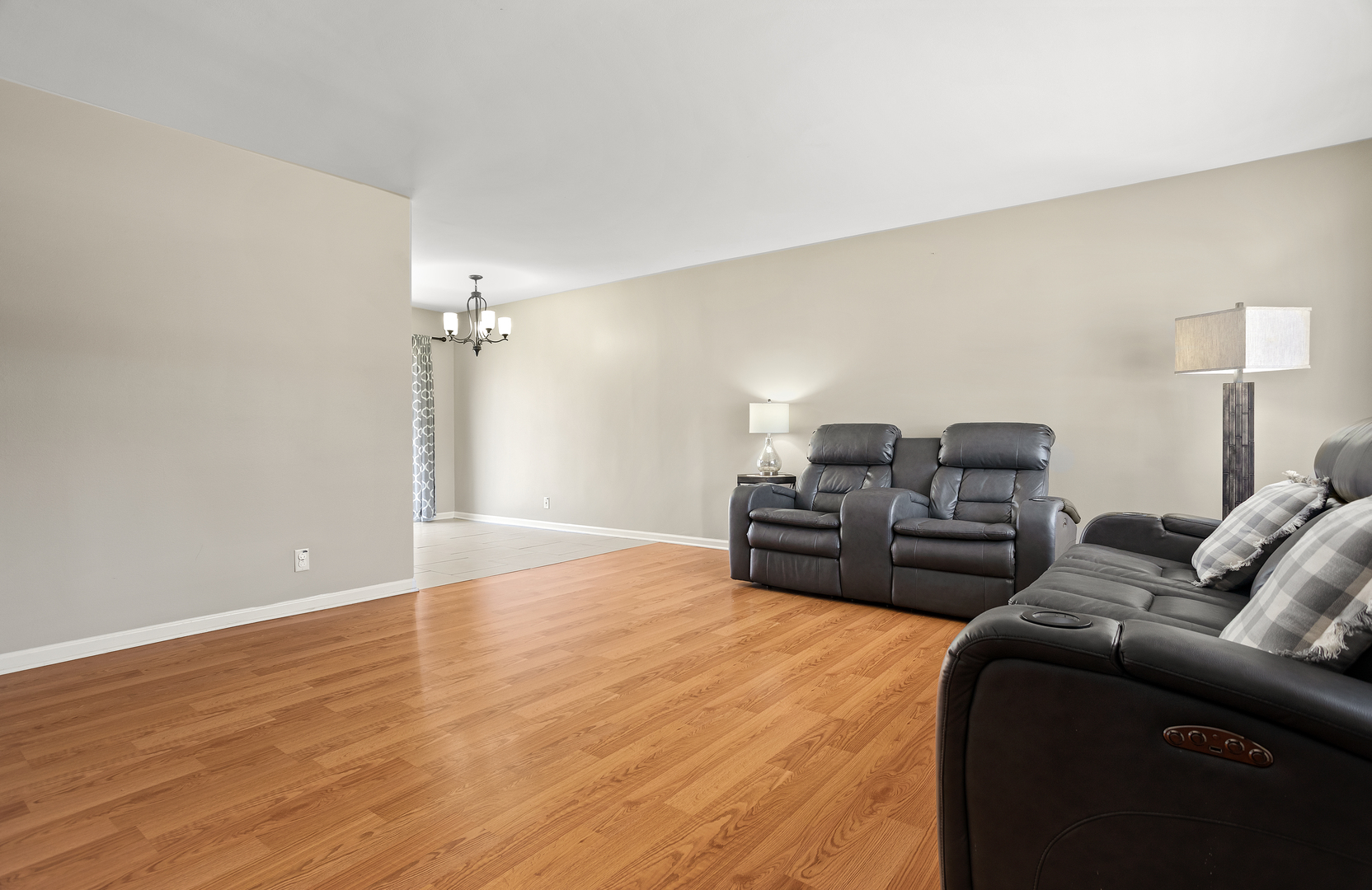 206 Seabury Road Bolingbrook, IL 60440 - Photo 4 of 16 a living room with furniture a ceiling fan and a rug