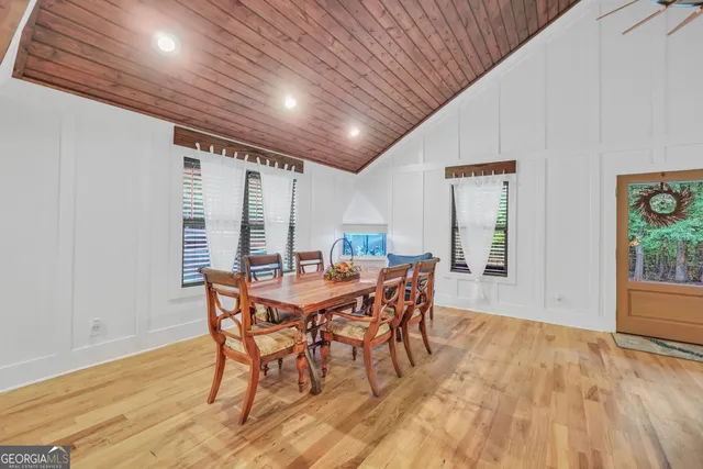 a spacious bedroom with a bed and a large window