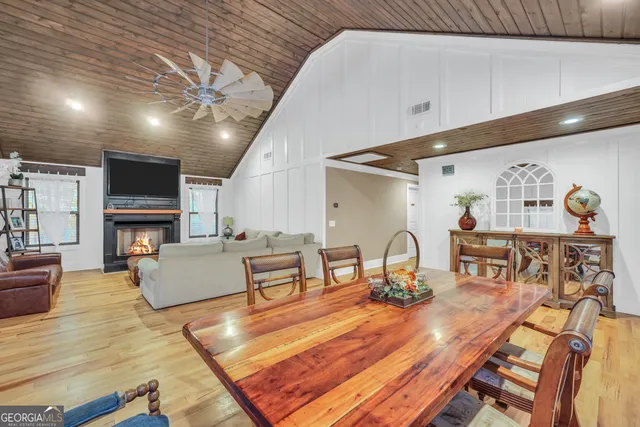 a bathroom with a sink a large mirror and a bathtub