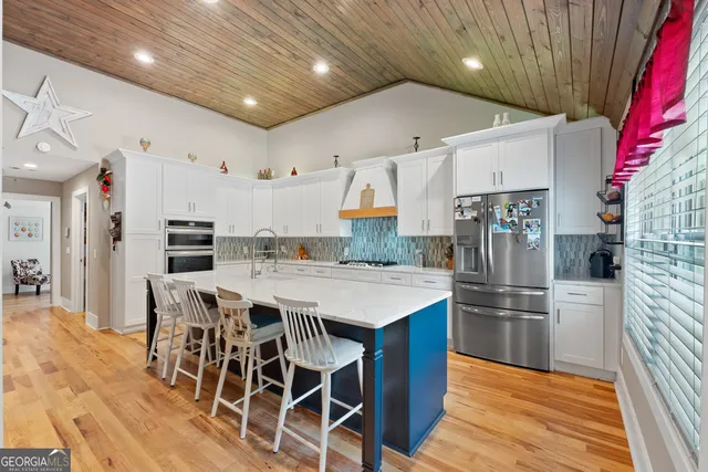 a bathroom with a bathtub and a toilet