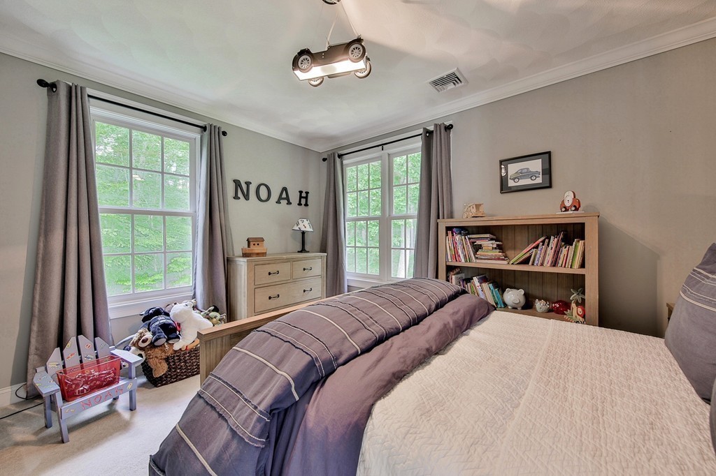 5 Wilkes Road Rowley, MA 01969 - Photo 15 of 25 a bedroom with a bed dresser and a window