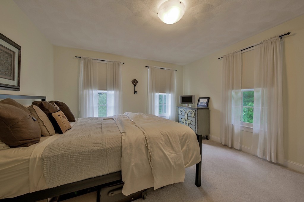 5 Wilkes Road Rowley, MA 01969 - Photo 17 of 25 a bedroom with a bed and a window