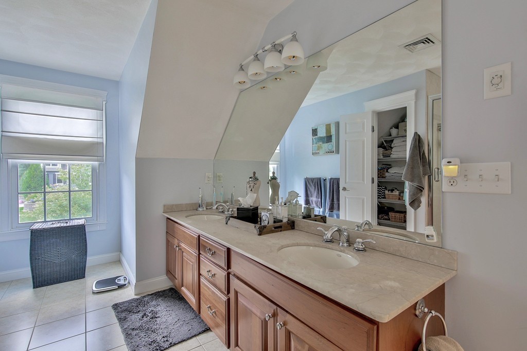 5 Wilkes Road Rowley, MA 01969 - Photo 20 of 25 a bathroom with a sink a vanity and a mirror