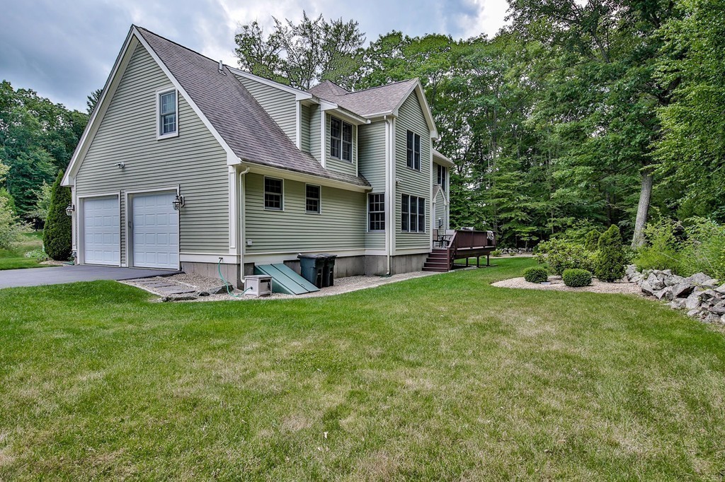 5 Wilkes Road Rowley, MA 01969 - Photo 23 of 25 a front view of house with yard and green space