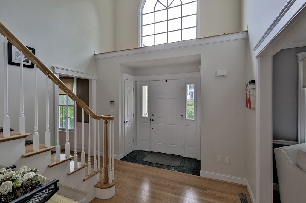 5 Wilkes Road Rowley, MA 01969 - Photo 3 of 25 a view of entryway with wooden floor and stairs
