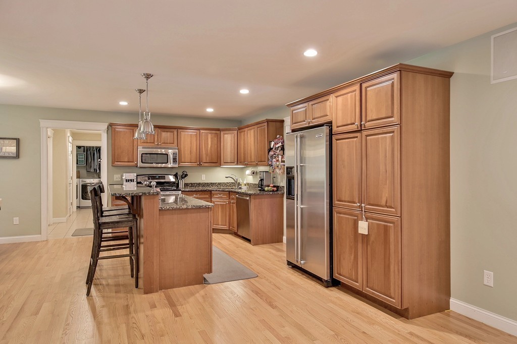 5 Wilkes Road Rowley, MA 01969 - Photo 6 of 25 a kitchen with stainless steel appliances granite countertop a refrigerator stove top oven and sink