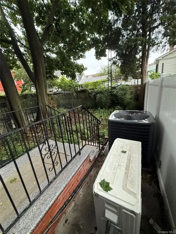 a view of balcony with wooden floor