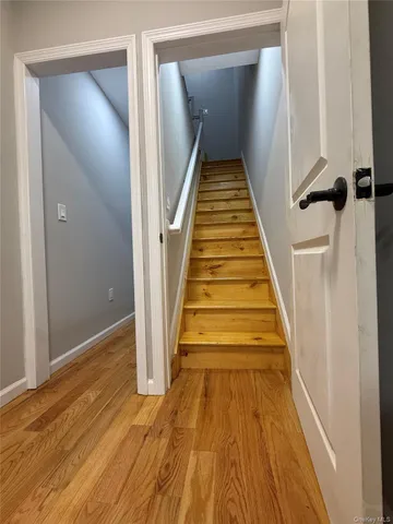 wooden floor with a staircase