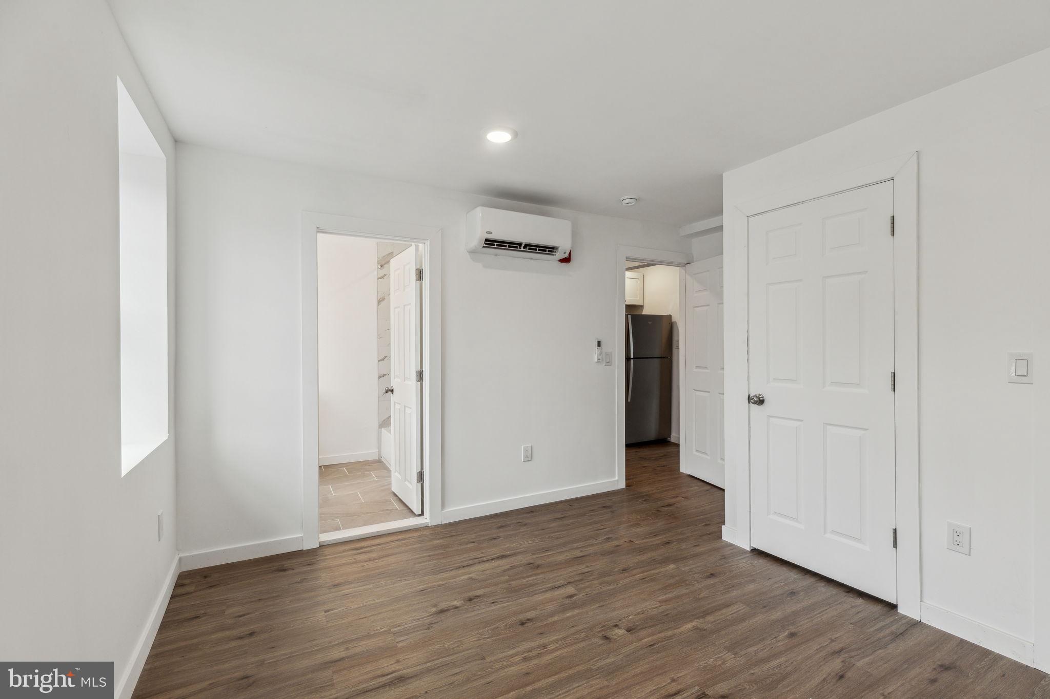 7039 Ridge Avenue Philadelphia, PA 19128 - Photo 25 of 26 a view of an empty room with wooden floor and closet