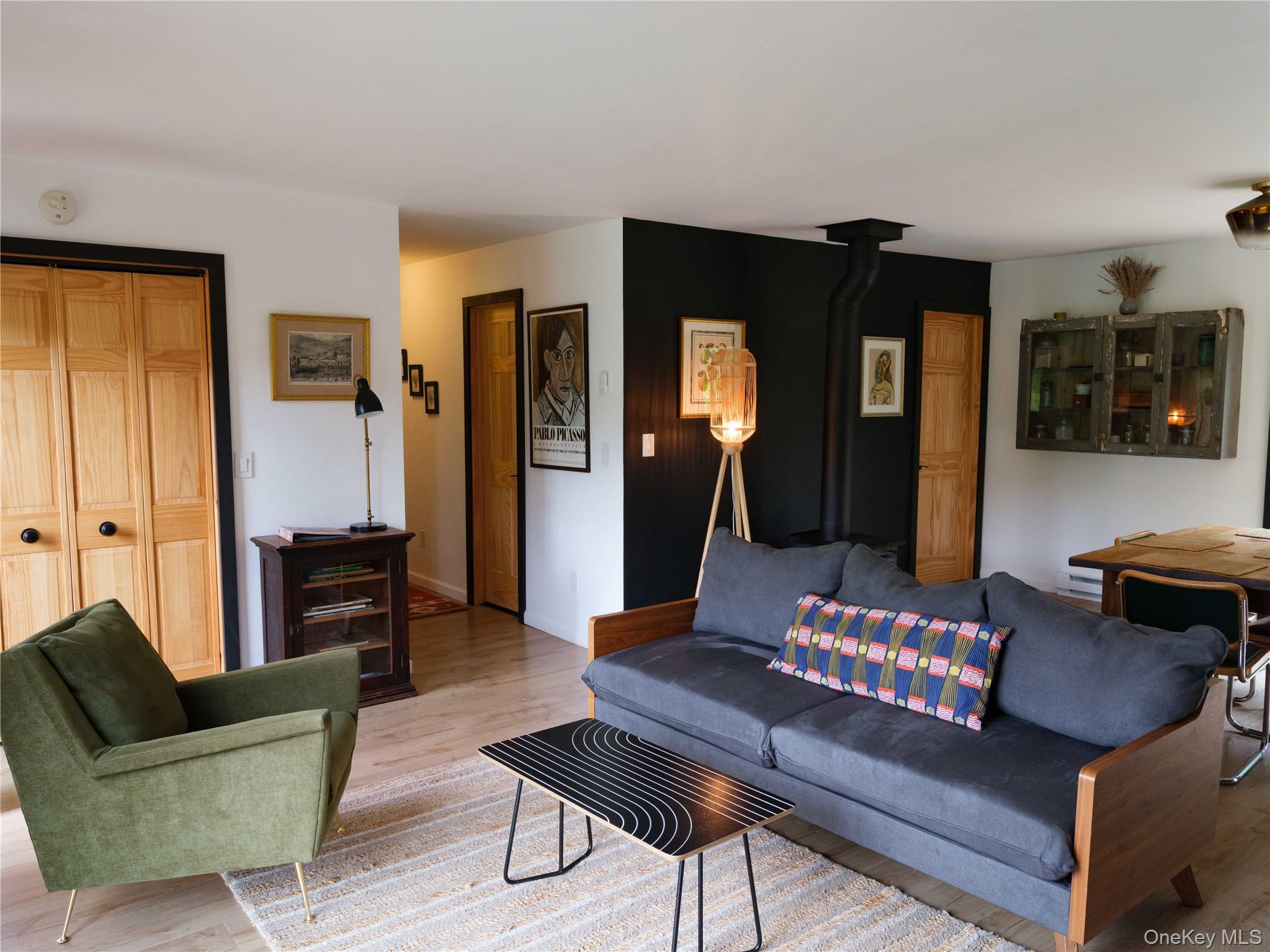 260 Gladstone Hollow Road Andes, NY 13731 - Photo 11 of 39 a living room with furniture and a wooden floor