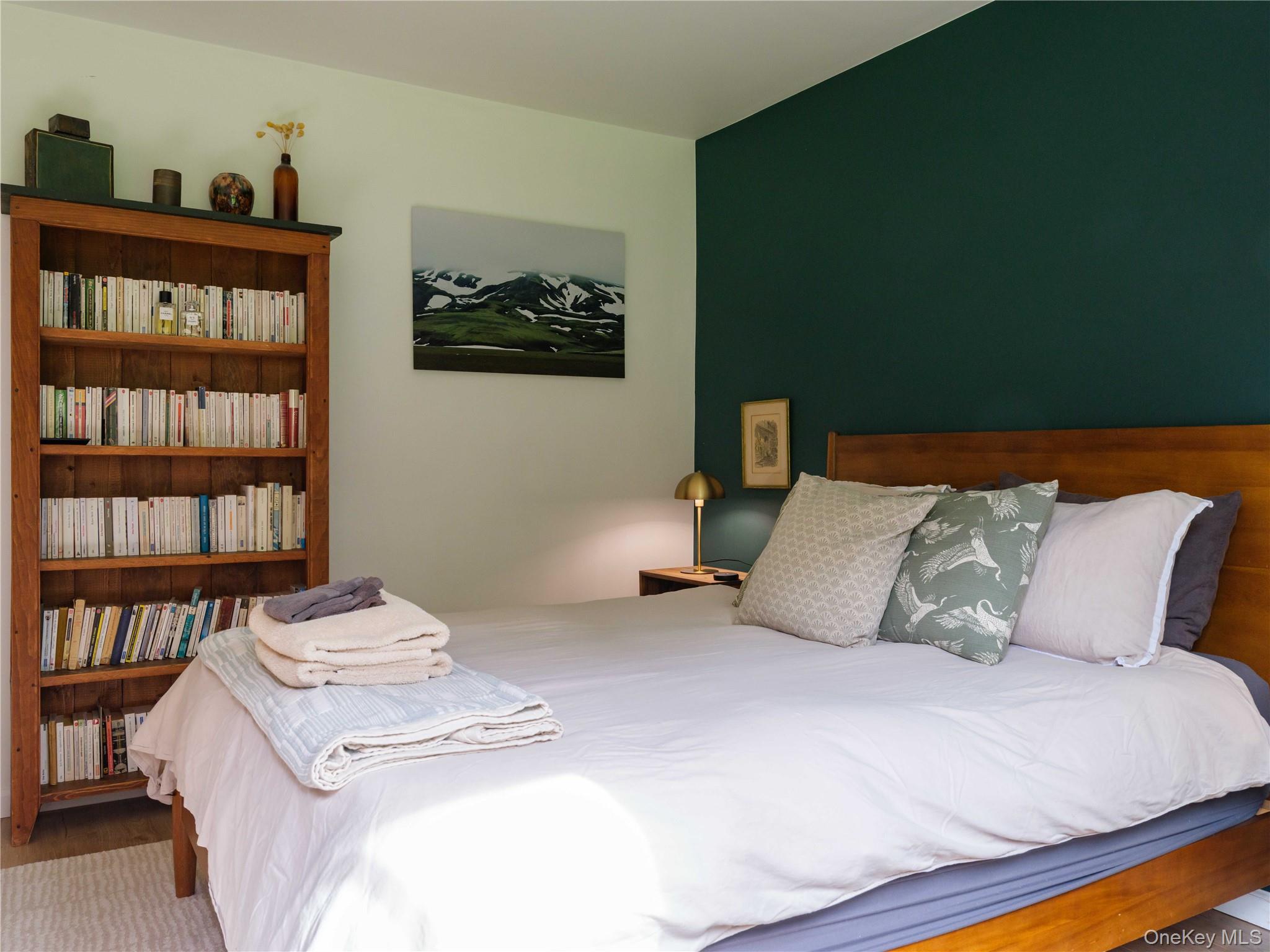 260 Gladstone Hollow Road Andes, NY 13731 - Photo 14 of 39 a bedroom with a bed and a book shelf