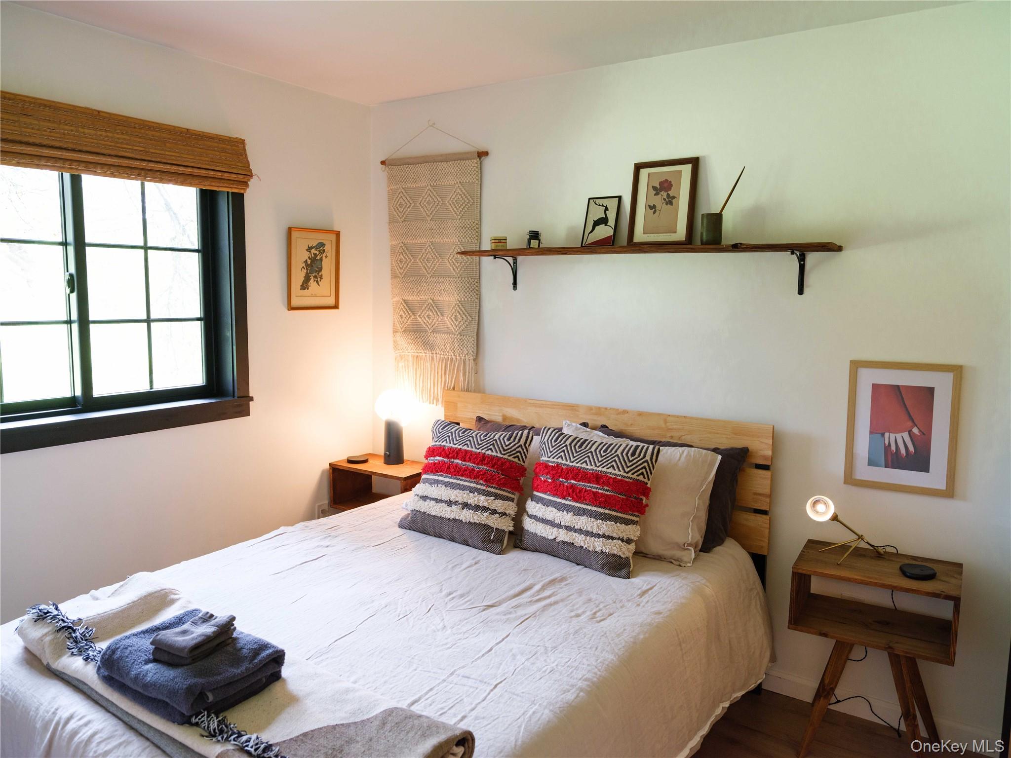 260 Gladstone Hollow Road Andes, NY 13731 - Photo 15 of 39 a bedroom with a bed and wooden floor