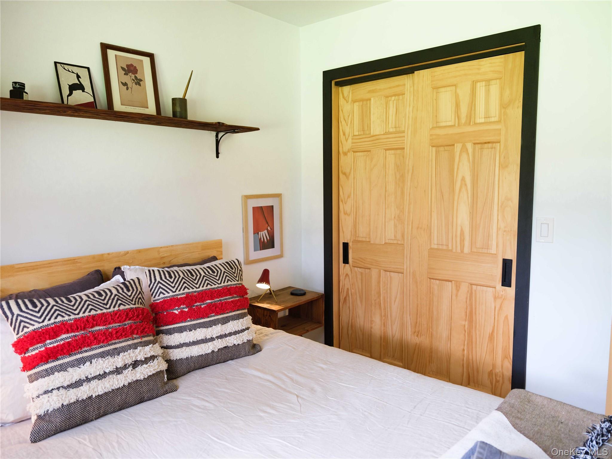 260 Gladstone Hollow Road Andes, NY 13731 - Photo 16 of 39 a bedroom with a bed and a window