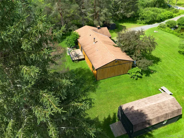 an aerial view of a house having yard