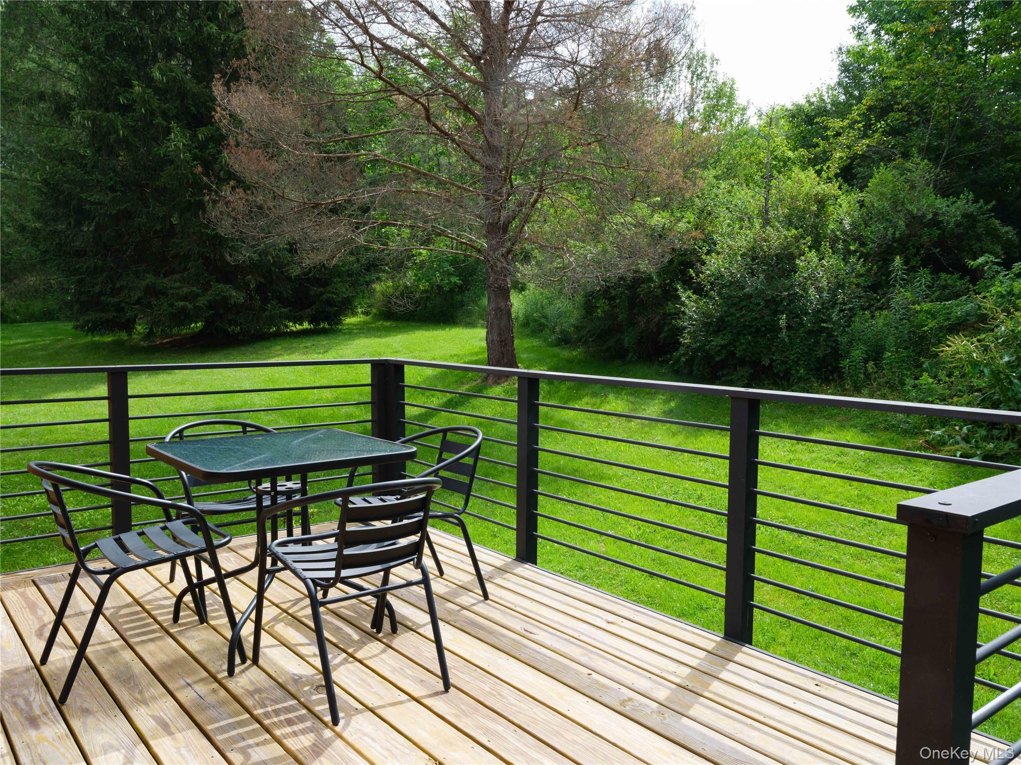 260 Gladstone Hollow Road Andes, NY 13731 - Photo 23 of 39 a green bench sitting on top of a wooden floor
