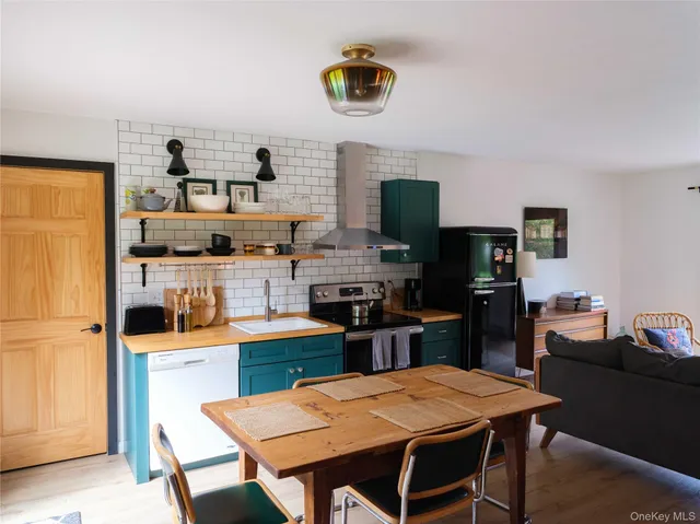 a kitchen with a dining table and chairs