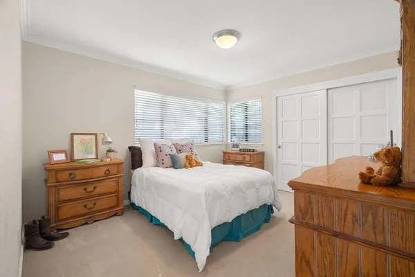 a bedroom with a bed and window