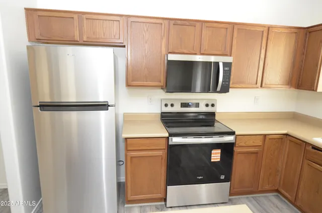 a kitchen with a stove microwave and refrigerator