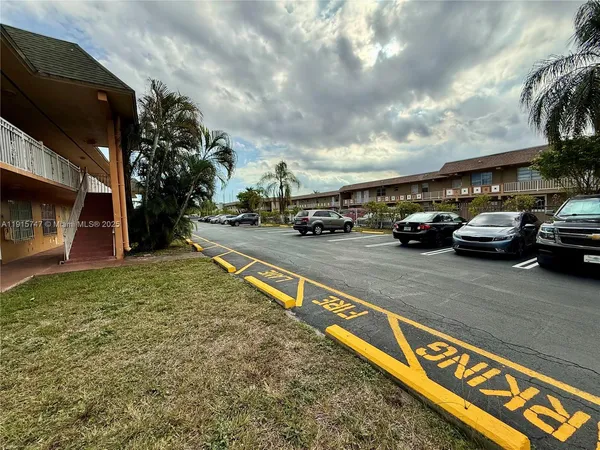 a view of a street with cars