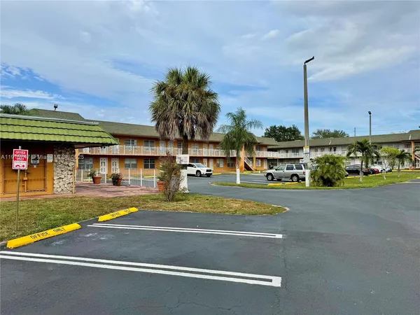 a view of an swimming pool with a yard