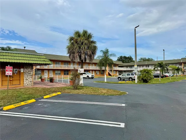 a view of an swimming pool with a yard