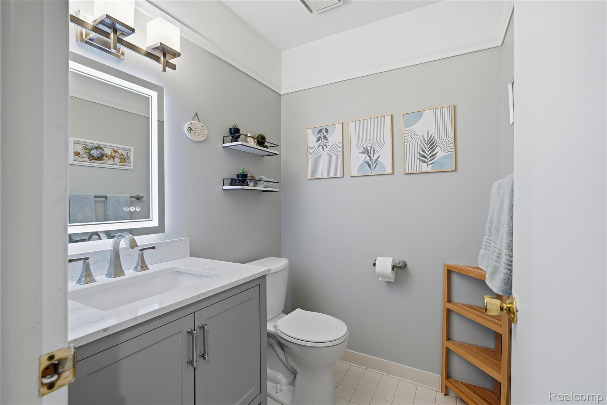 1687 Lodge Pole Lane Rochester, MI 48309 - Photo 15 of 53 Full bathroom featuring a single vanity with stone countertop, undermount sink, and brushed nickel faucet