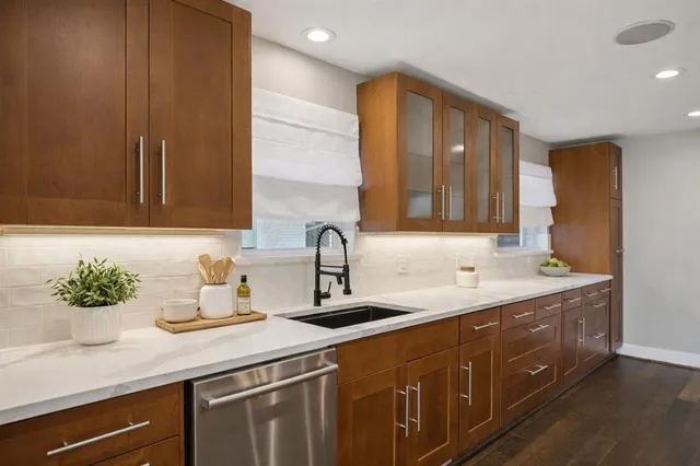 a kitchen with a sink and cabinets